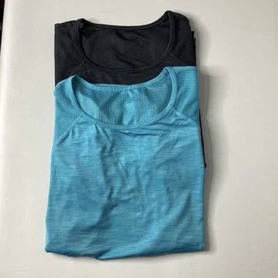 **2** Camiseta sin mangas Tapout para adulto talla XL (1) gris y (1) verde azulado acuático atlética para mujer Foto 1 de 4