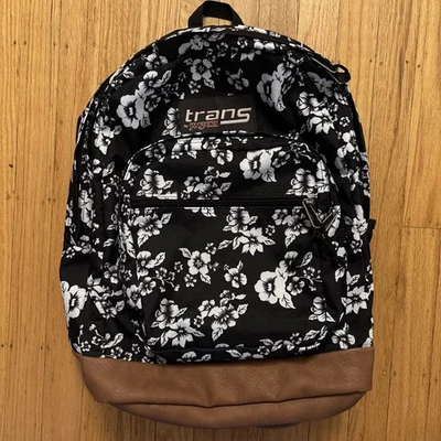JanSport Trans Backpack Black w/ White Flower Print & Faux Leather Bottom - Image 1 of 4
