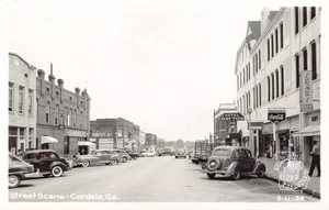 GA~GEORGIA~CORDELE~STREET SCENE~COKE SIGN~HOTEL DAYTON~SEARS~CLINE RPPC - Picture 1 of 3