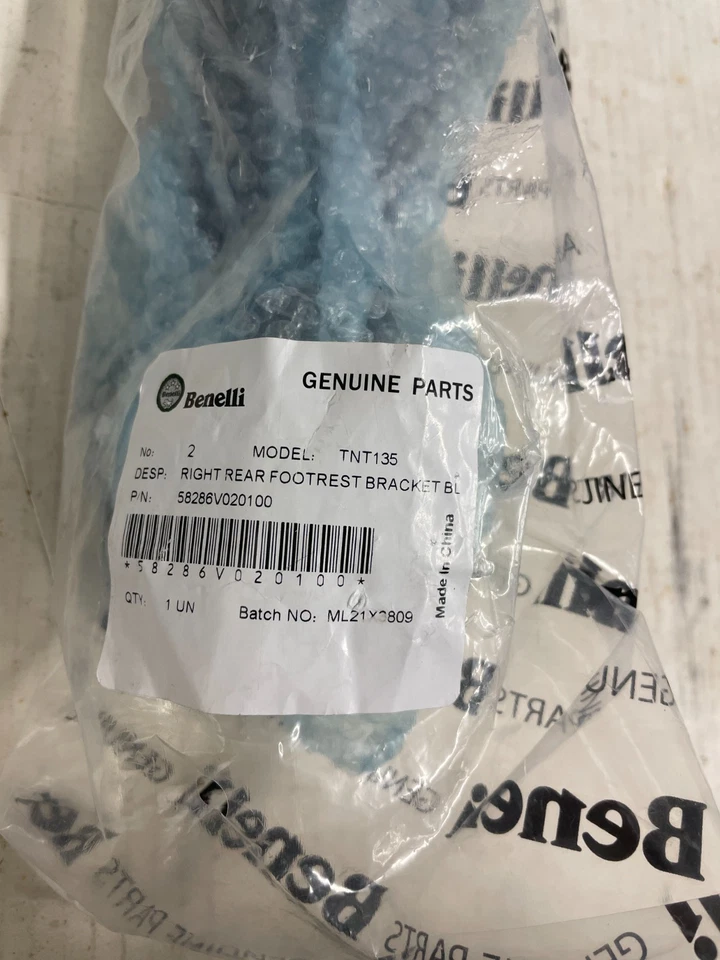 58286V020100 OEM Benelli Right Passenger Footpeg Bracket 20 - 23 TNT 135 - Image 1 of 3