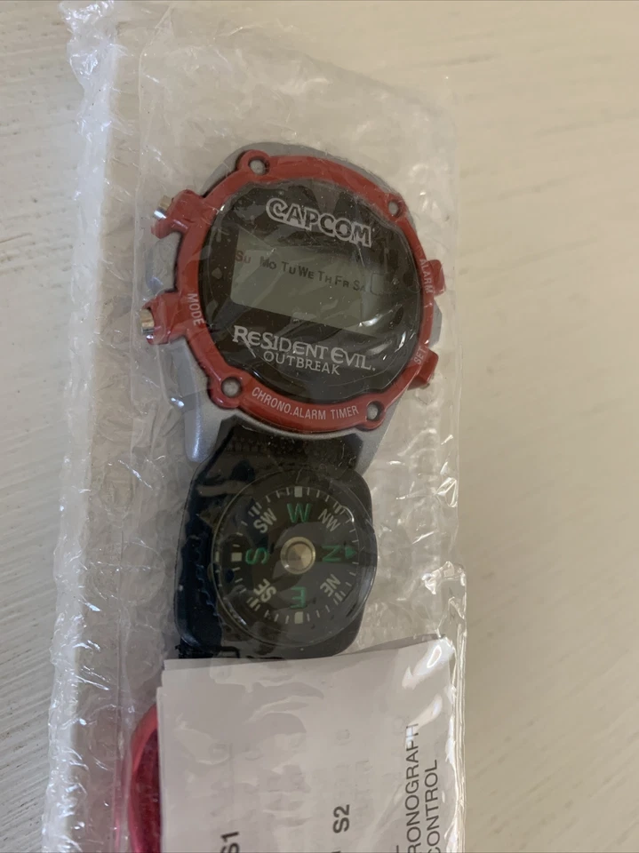 Resident Evil Outbreak EB Promo Reloj Brújula TOTALMENTE NUEVO Capcom PS2 PlayStation 2 Foto 1 de 4