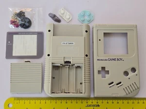 KIT GUSCIO CONSOLE NINTENDO GAMEBOY ORIGINALE GBO RICAMBIO COMPLETO GRIGIO NUOVO DI ZECCA! - Foto 1 di 2