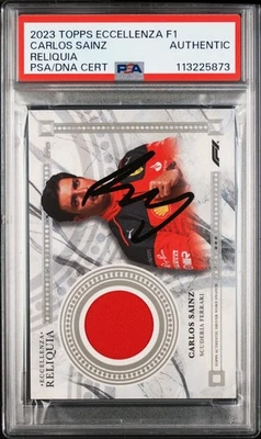 F1 CARLOS SAINZ SIGNED TOPPS F1 ECCELLENZA RELIC PATCH CARD 2023 PSA AUTHENTIC - Image 1 of 2
