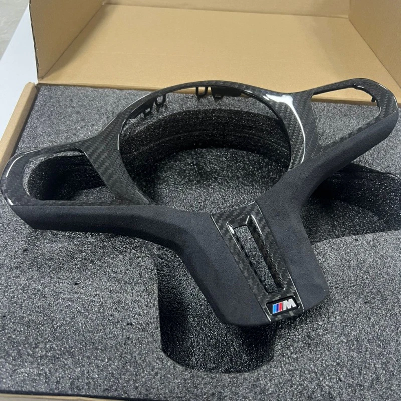 Tapicería de volante Alcantara de fibra de carbono para BMW X5 M50i M60i G05 2019-2026 Foto 1 de 2