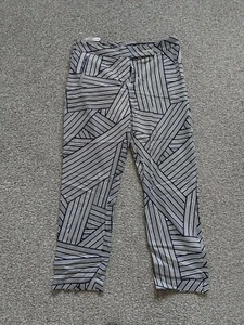 WOMANS DOROTHY PERKINS NAVY WHITE PATTERN STRETCH TAPERED LEG TROUSERS UK 12  - Picture 1 of 4