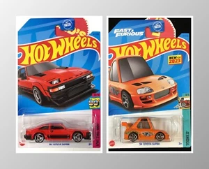 Lotto 2x Hot Wheels '94 Toyota Supra Kitty Face Arancione & '82 Supra Rosso anni '80 - Foto 1 di 16