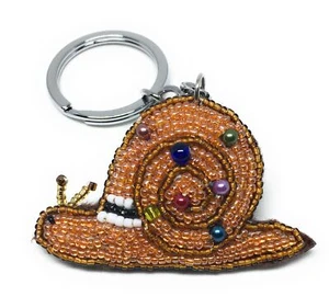Llavero artesanal con cuentas de caracol animal exterior - Imagen 1 de 4