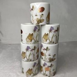 Lot of 7 Enesco White Napkin Rings Flowers & Butterflies Bees Ceramic 1¾ x 1¾" - Picture 1 of 7