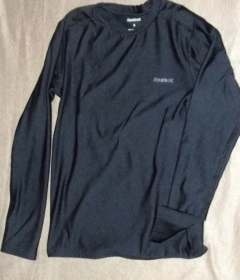 CAMISA DEPORTIVA REEBOK JUVENIL PEQUEÑA USADA Foto 1 de 1