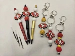 Lotto 9 pezzi portachiavi e penne perline silicone San Francisco 49ers. - Foto 1 di 4