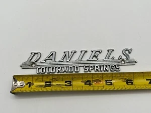 Vintage Metal Dealer Dealership Emblem / Badge - Daniels Colorado Springs, CO - Picture 1 of 4