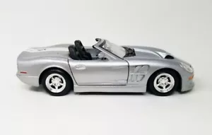 Shelby Series One® Convertibile 1999, scala 1/24 modellino auto pressofusa argento 31277 - Foto 1 di 6