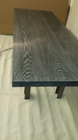 dining table of acid ebonized/limed white oak and hot rolled steel Cover