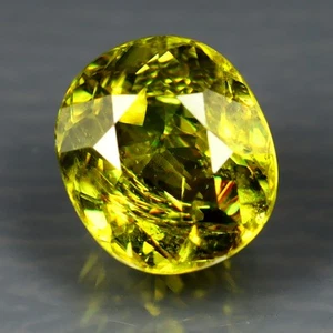 1.61 ct Oval Cut (7 x 6mm) Pakistan Multi Color Flashing Natural Sphene Gemstone - Picture 1 of 2