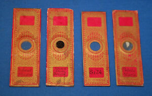Four 19th century glass paper covered microscope slides, starches and silk