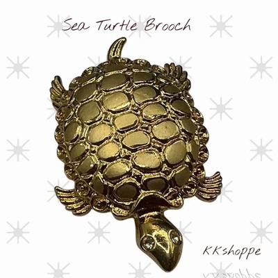 Broche de tortuga firmado tono dorado ojos de estrás concha texturizada prendedor figurativo Foto 1 de 3