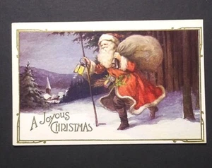 Una alegre Navidad Santa en la nieve con linterna postal dorada en relieve década de 1920 (a - Imagen 1 de 2