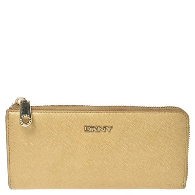 Cartera Dkny de cuero beige metálico con cremallera alrededor Foto 1 de 4