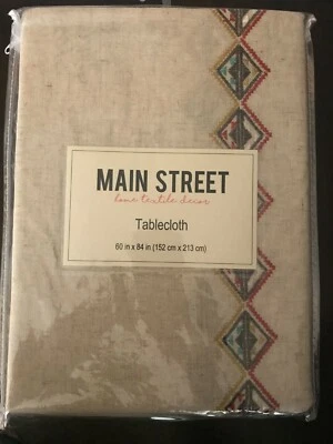 Main Street Cloth tablecloth ~ NWT ~ 60 in x 84 in ~ Beige w/embroidered pattern - Image 1 of 2