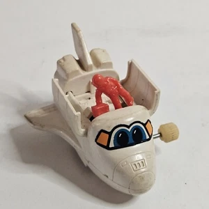 Vintage TOMY US Space Shuttle Astronaut Wind Up Toy Works - Picture 1 of 5