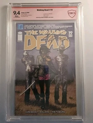 The Walking Dead #19-CBCS 9.4-Verified Signature Kirkman/Moore-1st app. Michonne - Image 1 of 2