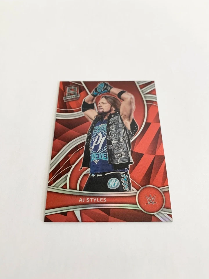 AJ Styles Red 171/199 2022 Panini Chronicles Spectra WWE # 379 - Image 1 of 2