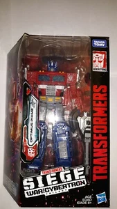 TRANSFORMERS BELAGERUNGSKRIEG FÜR CYBERTRON OPTIMUS PRIME BRANDNEU - Bild 1 von 6