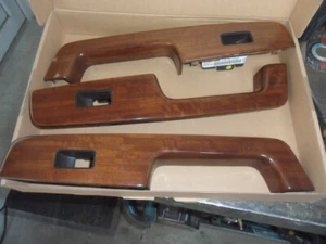 Cadillac STS 2005 Innentürgriffe aus PVC mit Holzdekor - Bild 1 von 2