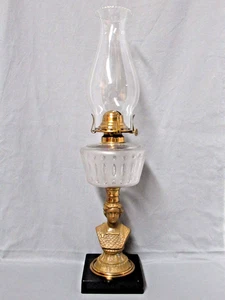 ANTIGUA LÁMPARA DE ACEITE COMPUESTA CON VÁSTAGO DE BUSTO DE BRONCE Y BASE DE METAL - Imagen 1 de 19