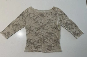 Beige Langarmbluse mit glitzerndem Perlenmuster. - Bild 1 von 6