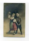 Antique tinted RPPC photo postcard, children in traditional German Clothing 1911