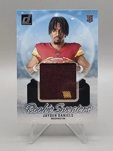 2024 Panini Donruss - Rookie Holiday Sweaters Jayden Daniels #RHS-JDA (MEM, RC) - Bild 1 von 2
