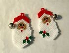 A pair of hand beaded Santa Head dangle earrings. With a little bell. 1&3/8"long
