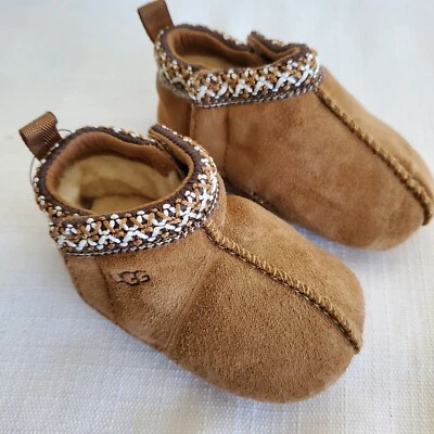 NWOB UNISEX INFANT 0/1 0-6 MONTHS CHESTNUT UGG TASMAN SUEDE SLIPPERS 1130359I - Image 1 of 4