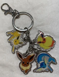 Pokemon EEVEELUTION Schlüsselanhänger 2016 Vaporeon Jolteon Flareon & Eevee Offical Rare - Bild 1 von 9