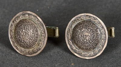 Par de gemelos con la piedra solar azteca Foto 1 de 4