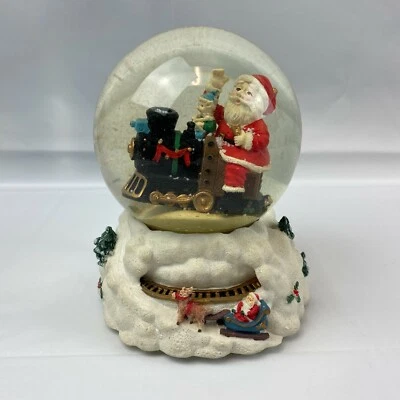 Globo de nieve de Navidad Santa en un tren juega "Te deseamos una Feliz Navidad" Foto 1 de 4