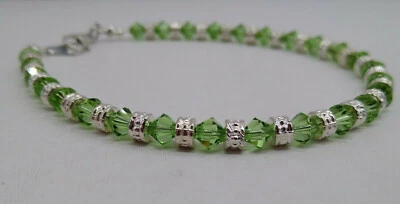 Tobillera/pulsera hecha a mano con cuentas de rondel bicono y peridoto de cristal de Swarovski Foto 1 de 2