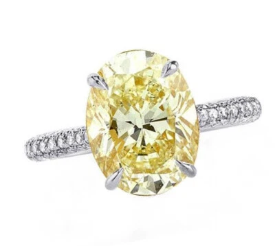 Anillo de compromiso de oro blanco de 18 k con diamantes ovalados amarillos de lujo de 4,23 quilates certificado por GIA Foto 1 de 4