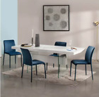 Dwell Sturado 6-8 Seater Extending Dining Table with four Sottile dining chairs.
