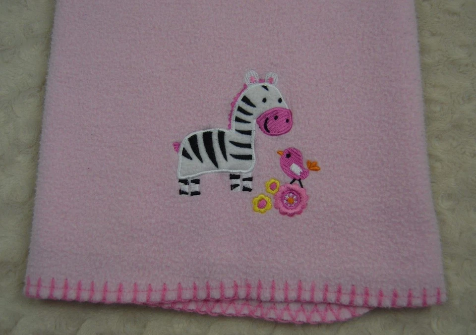 Manta de bebé con pájaro cebra Garanimals con borde cosido rosa Flor naranja Negro Forro polar Foto 1 de 4