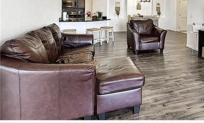 2 Piece Ashley Leather Sofa Chaise Queen Sleeper And Chair in Good Condition - Image 1 of 2