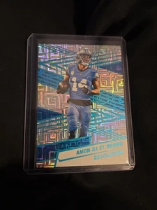 2025 Panini Revolution #180 Amon-Ra St Brown Teal Levels 391/499 Detroit Lions  - Bild 1 von 2