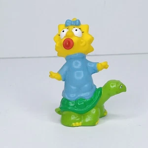 Vintage Simpsons 1990 Maggie Simpson Turtle Action Figure EUC Free SH - Imagen 1 de 6