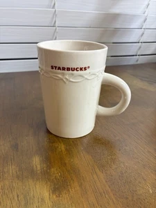 2010 Starbucks Coffee Tea Mug Cup White Embossed Detail Red Lettering 10oz - Picture 1 of 3
