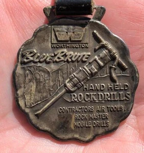 ANTIQUE - WORTHINGTON BLUE BRUTE HAND HELD ROCK DRILLS - HOLYOKE, MASS WATCH FOB - Picture 1 of 1