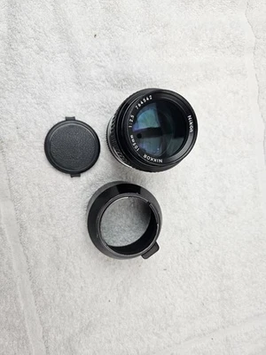 LENTE DE CÁMARA NIKON NIKKOR 1:2.5 105 MM CON CAPUCHA HS-8 Foto 1 de 4