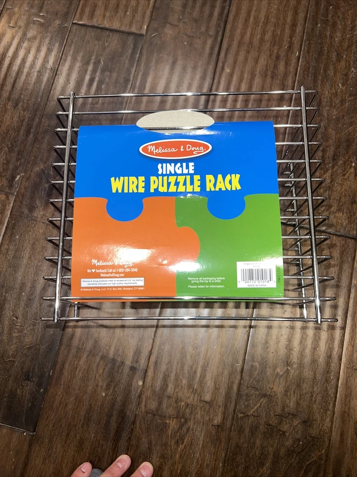 Estante de almacenamiento de rompecabezas Melissa & Doug - Estante de alambre para 12 rompecabezas Foto 1 de 3