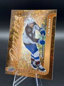 2024-25 Upper Deck Series 2 #DZ-64 Cale Makar Dazzlers Orange - Picture 1 of 2
