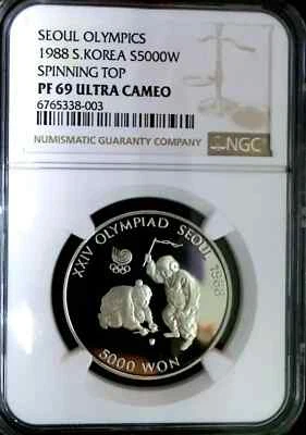 NGC PF69 UC-Corea del Sur 1988 Sprinning Top Plata 5000 Won Prueba Casi Perfecta Foto 1 de 2